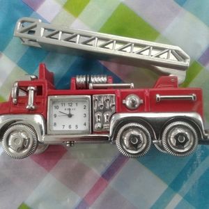 Metal working toy fire truck with inset clock
